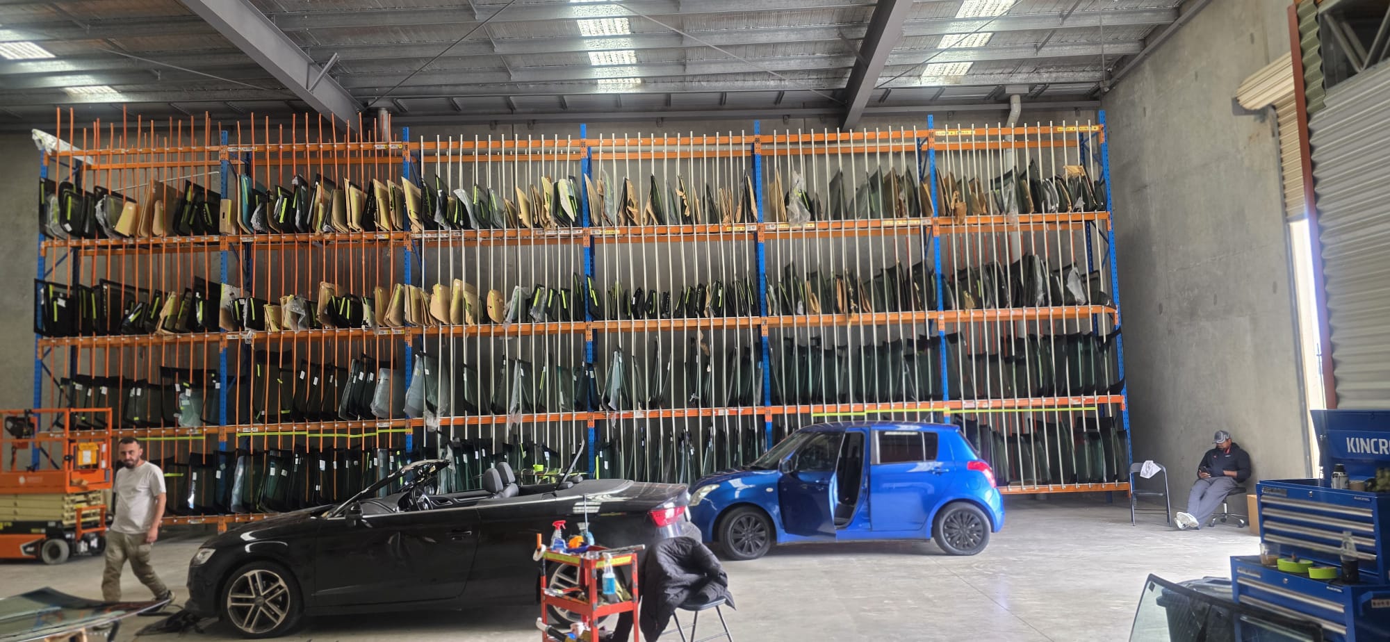 Glass warehouse with hundreds of windscreens in stock
