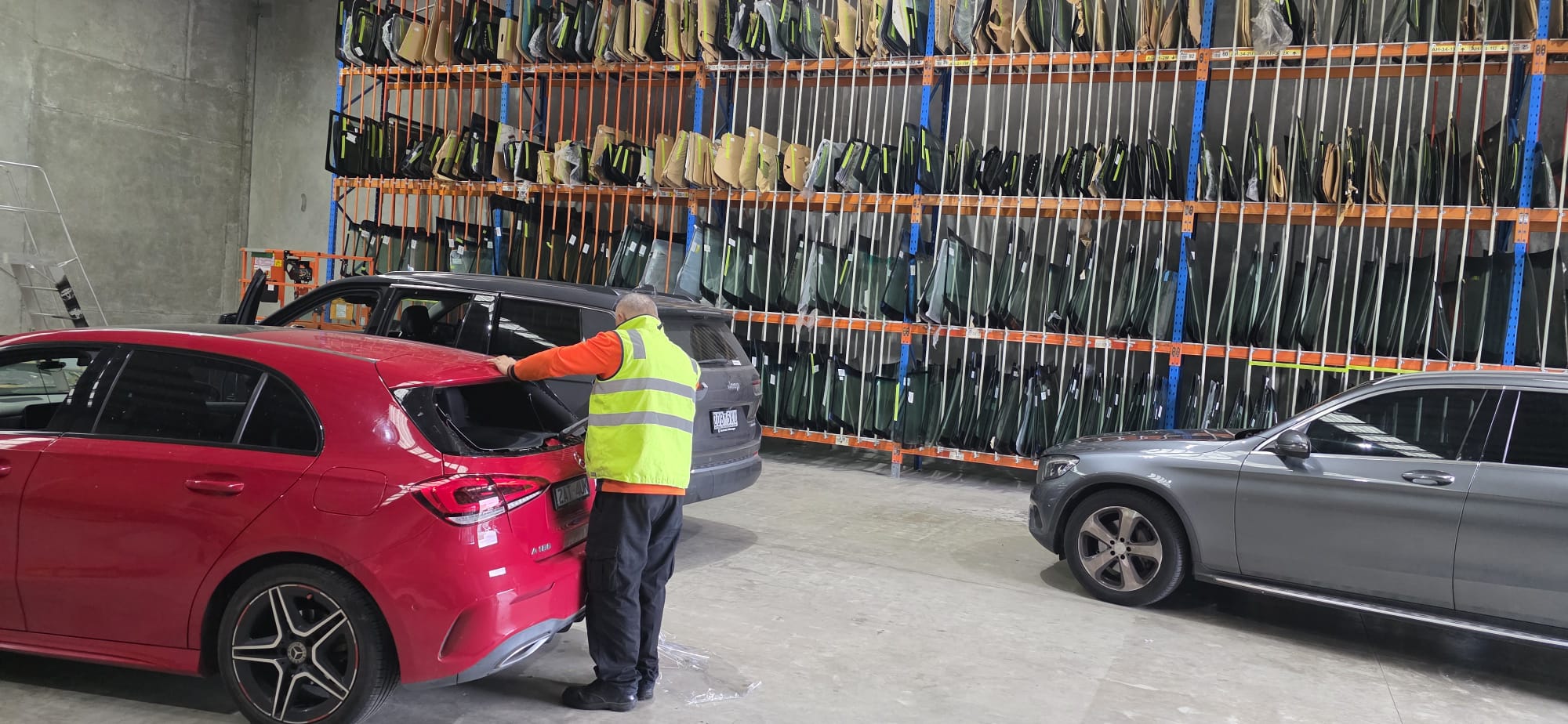 Technician replacing windscreen on Mercedes